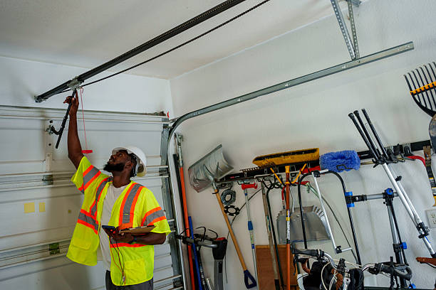 Professional Garage Door Panel Replacement technician working in Ladonia, AL